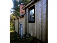 Kilsågad panel på hus i Övre Älmesbo, Edsbyn